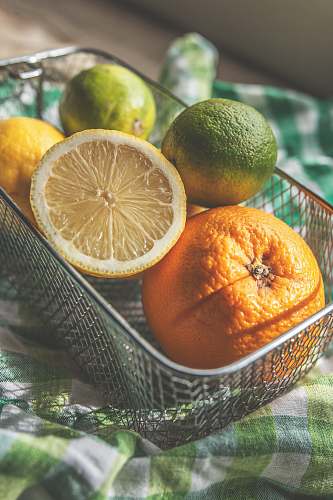 citrus fruit lemons and oranges in basket fruit